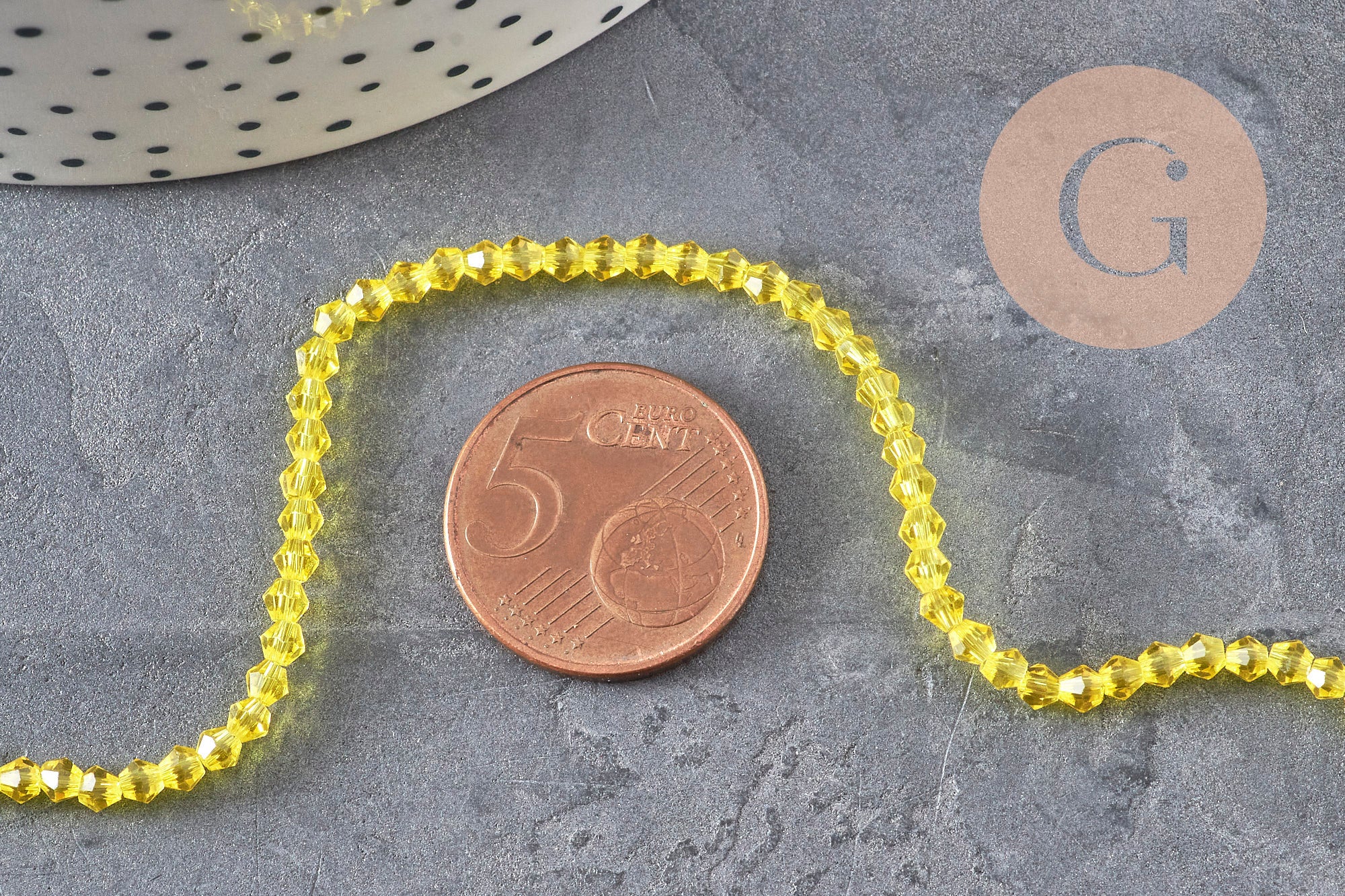 Perles cristal toupies à facette jaune transparent 3-3.3mm, x1 fil de 38cm (G11110)