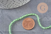 Perles cristal toupies à facette vert transparent 3-3.3mm, x1 fil de 38cm (G11111)
