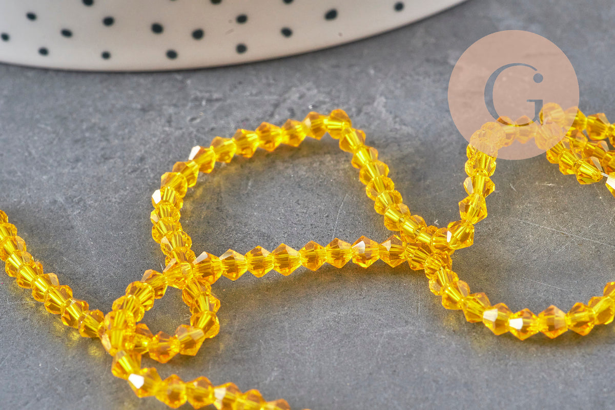 Perles toupies cristal à facette jaune 3.8x3mm, x1 fil de 32.5cm (G11343)