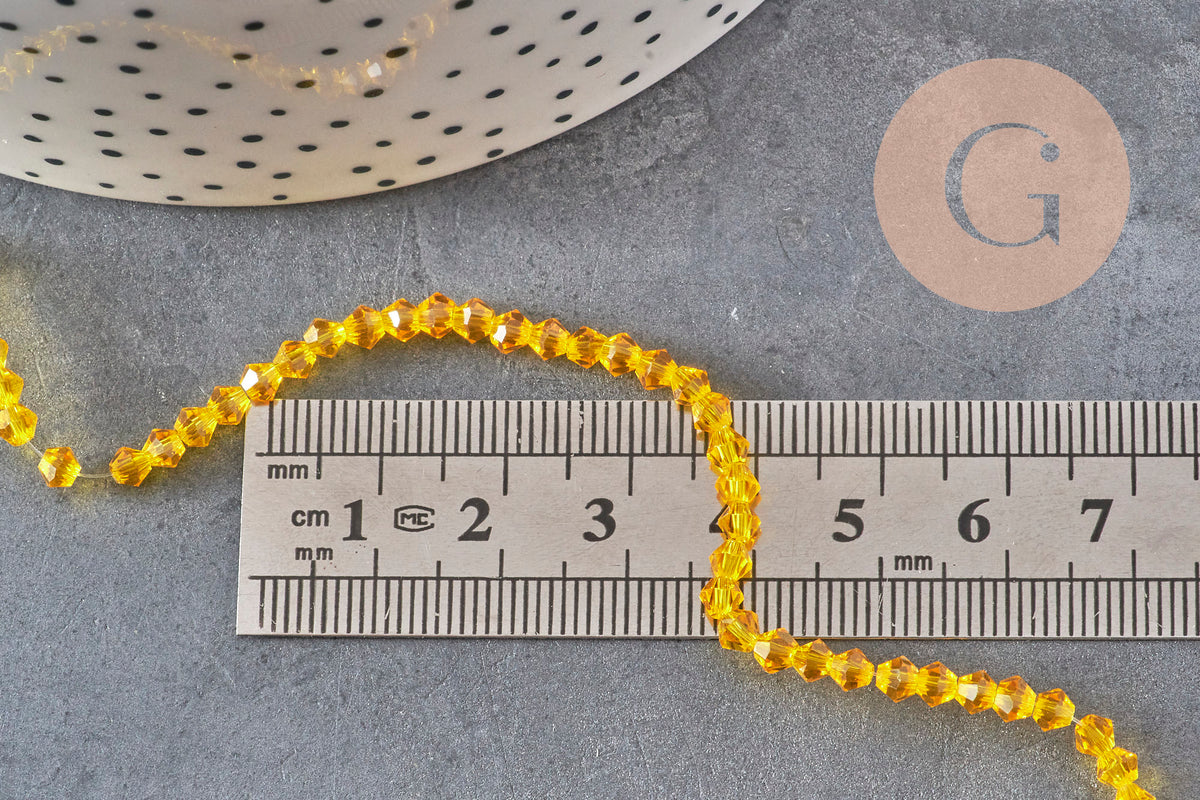 Perles toupies cristal à facette jaune 3.8x3mm, x1 fil de 32.5cm (G11343)