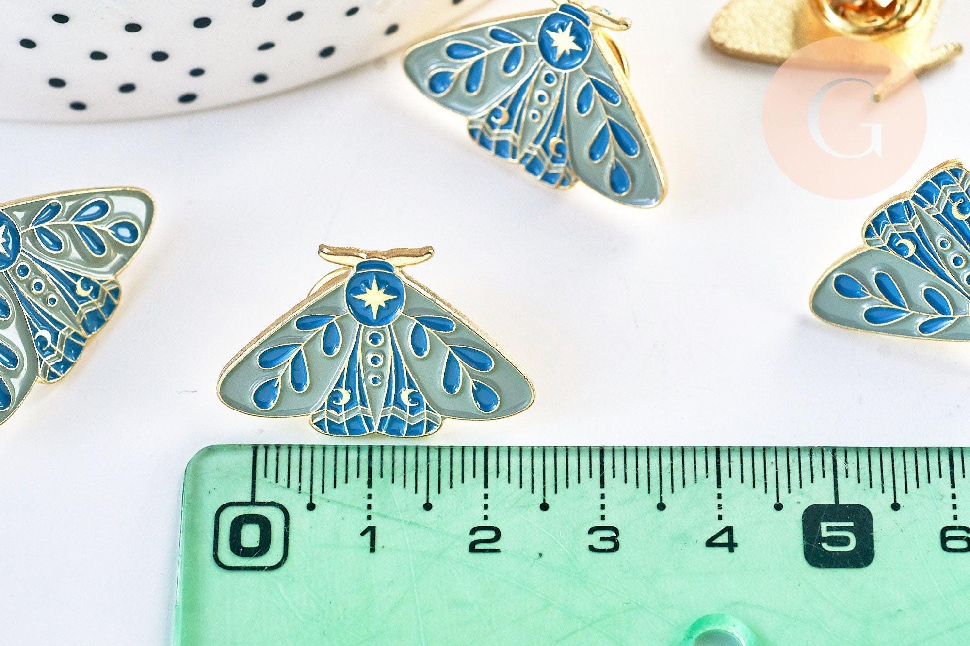 Broche pins papillon mystique doré émail bleu 27.5x18mm, x1 (G5547)