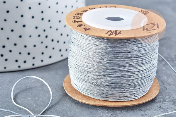 Cordon argenté tressé polyester 0.6mm, cordon fil de jade pour bijoux, x1 mètre G8449