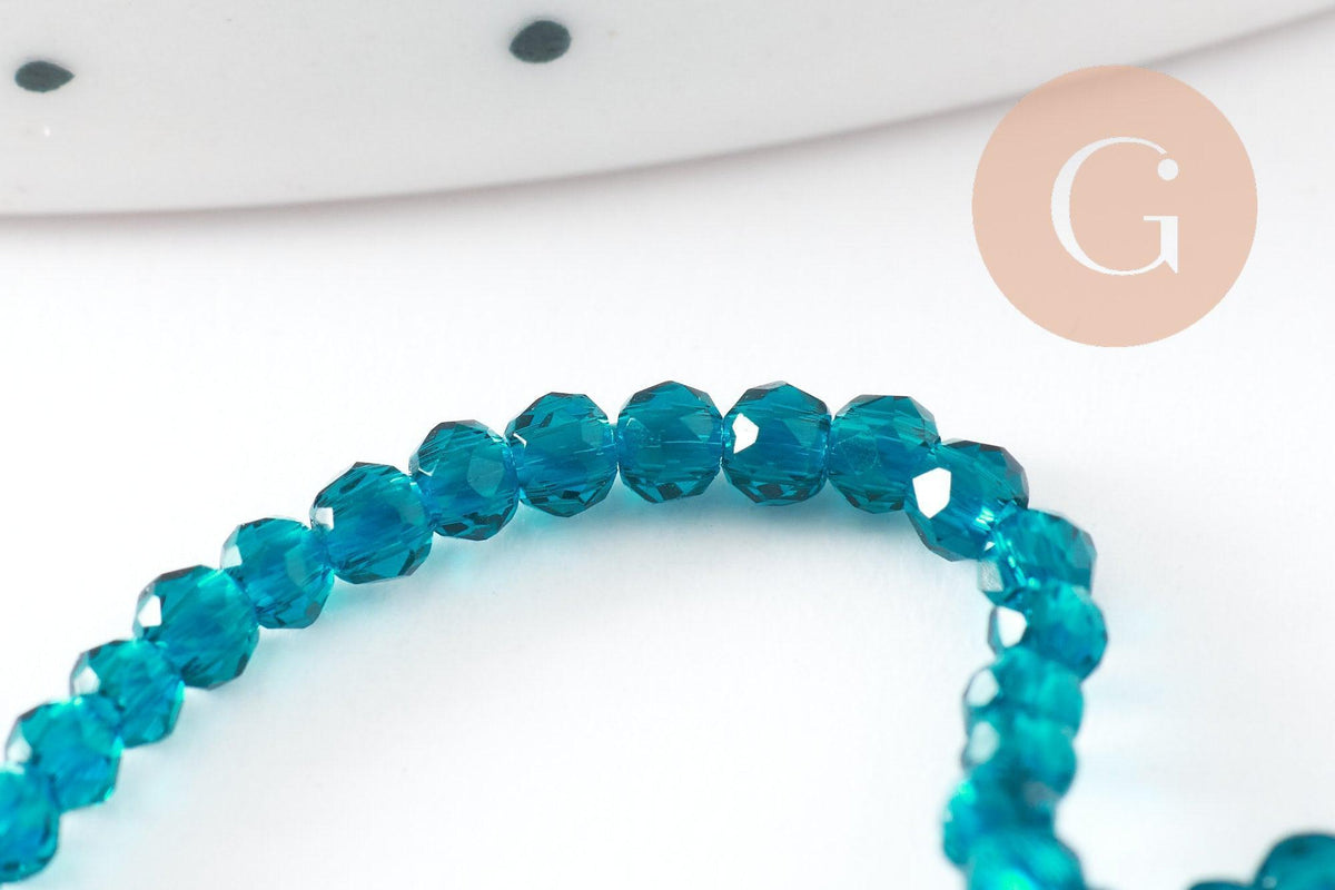Perle ronde verre facettée transparente bleu turquoise 2mm, x1 fil de 37 cm (G7447)