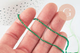 Perle ronde verre facettée transparente vert foncé 2mm, fourniture création de bijoux DIY, fil de 37cm, x1 (G7393)