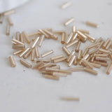 Perles rocaille Tube rose champagne metallisé 6mm x 2mm, x10gr (G2459)