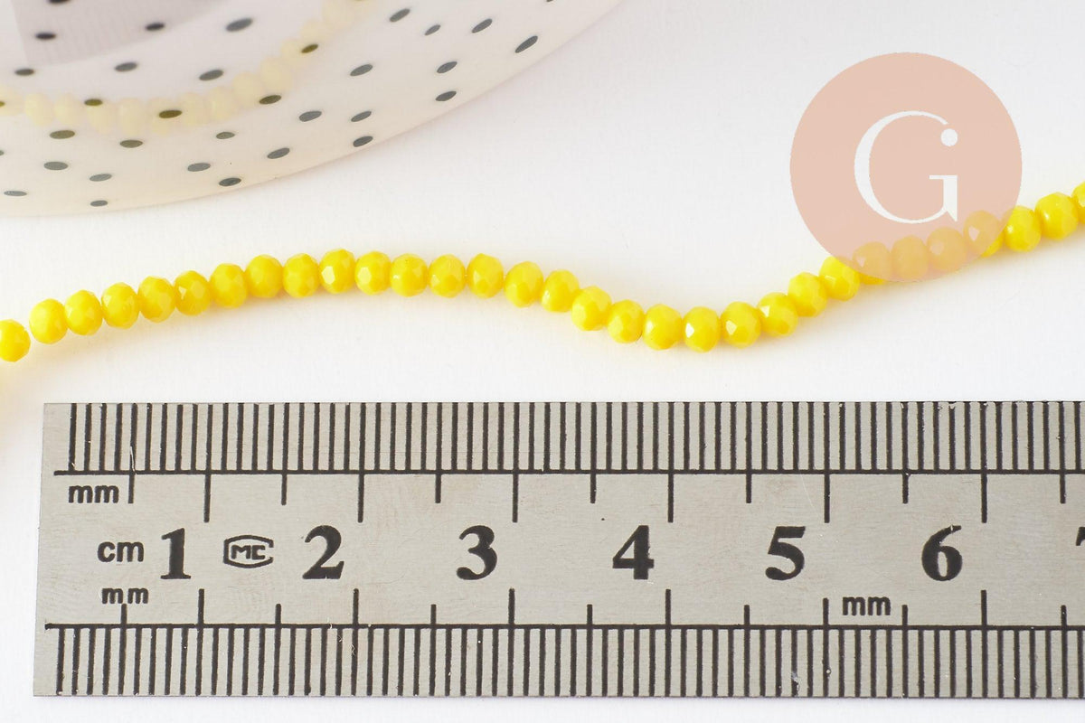 Perles rondelles verre jaune opaque facette 3x2mm, x1 fil de 32cm (G8256)