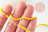 Perles rondelles verre jaune opaque facette 3x2mm, x1 fil de 32cm (G8256)