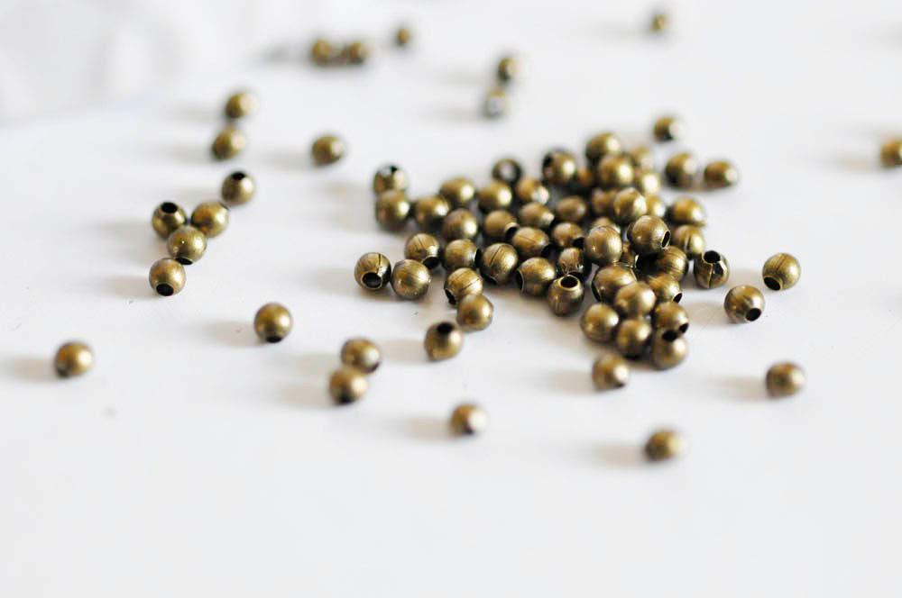 Perles rondes bronze intercalaires 2mm, x10 gr (G5147)