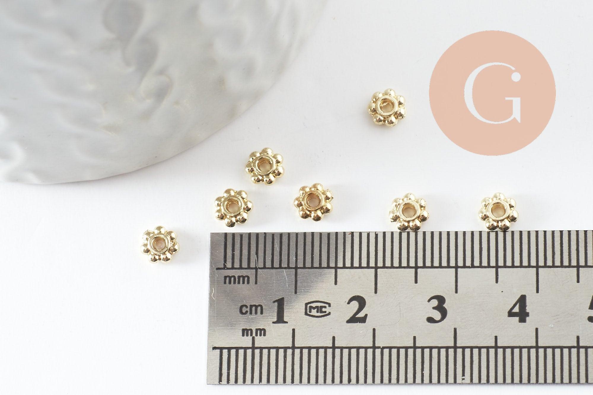 Rondelles fleurs intercalaires zamac doré 4mm, x20 (G9544)