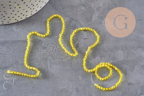 Perles cristal toupies à facette jaune transparent 3-3.3mm, x1 fil de 38cm (G11110)
