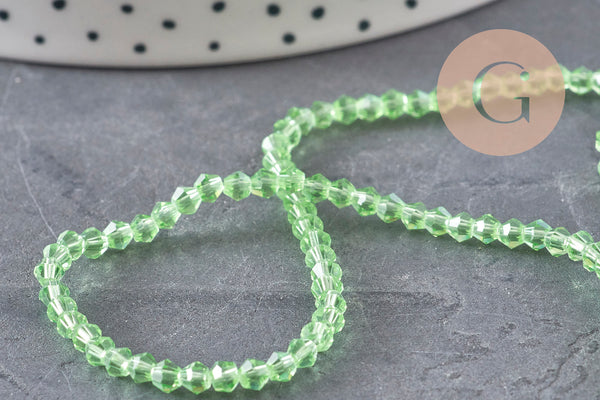 Perles cristal toupies à facette vert transparent 3-3.3mm, x1 fil de 38cm (G11111)