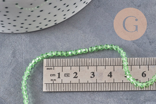 Perles cristal toupies à facette vert transparent 3-3.3mm, x1 fil de 38cm (G11111)