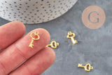 Colgante llave zamak dorado 15.5mm, x10 (G11227)