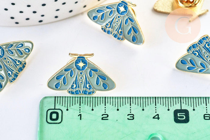Broche pins papillon mystique doré émail bleu 27.5x18mm, x1 (G5547)