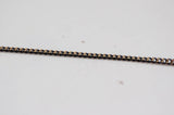 EP-Chaine fine maille plate noire reflets dorés 1.5mm, X 5 mètres G0554