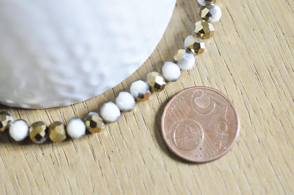 EP-Perles toupies cristal blanc doré 6x5mm x1 fil de 90, G4693