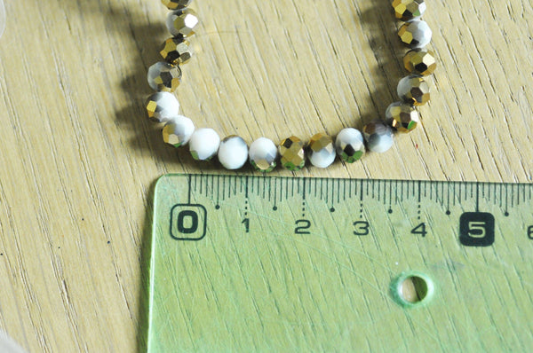 EP-Perles toupies cristal blanc doré 6x5mm x1 fil de 90, G4693