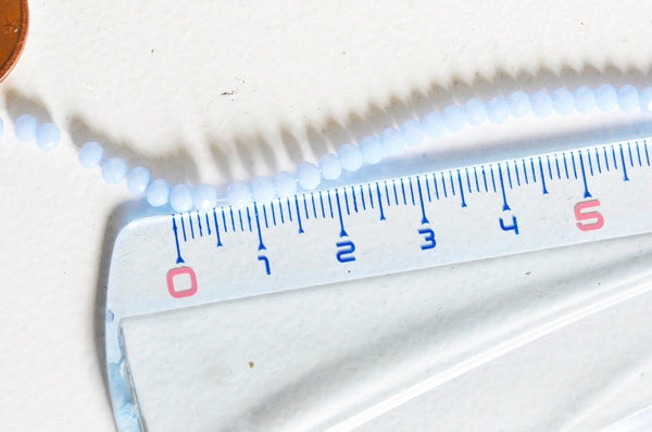 EP Perles toupies cristal bleu lavande, x1 fil de 135, 3x2mm G3607