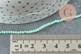 EP-Perles toupies cristal bleu turquoise 2.5mm, x1 fil de 33cm (G5940)