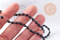 Perle ovale verre facetté noir 6x4mm, fil de 38cm x1 (G10628)