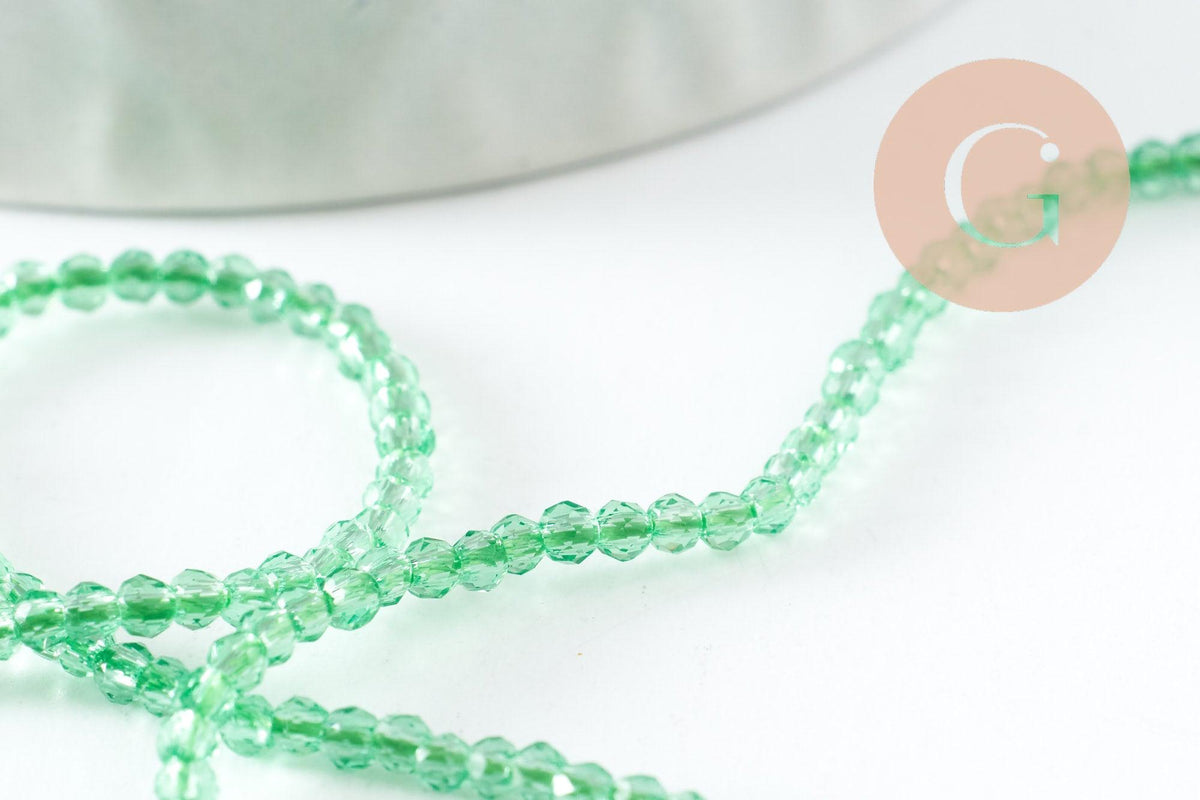 Perle ronde verre facettée transparente vert clair 2mm, x1 fil de 37cm (G7445)