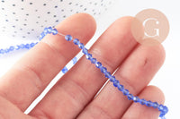 Perles cristal toupies à facette bleu transparent 3mm, x1 fil de 46cm (G2853)