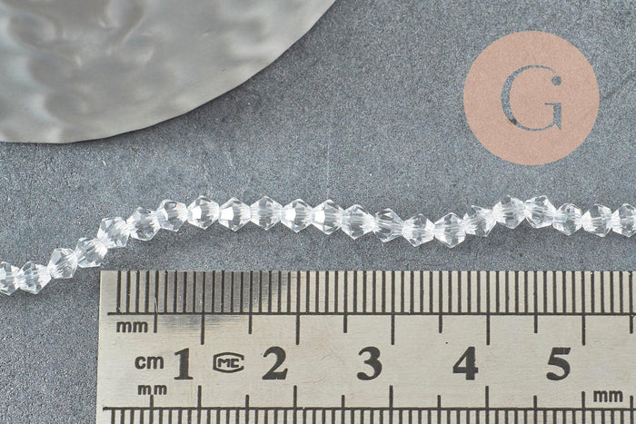 Perles cristal toupies facette transparent 3mm, x1 fil de 45 cm (G1632)