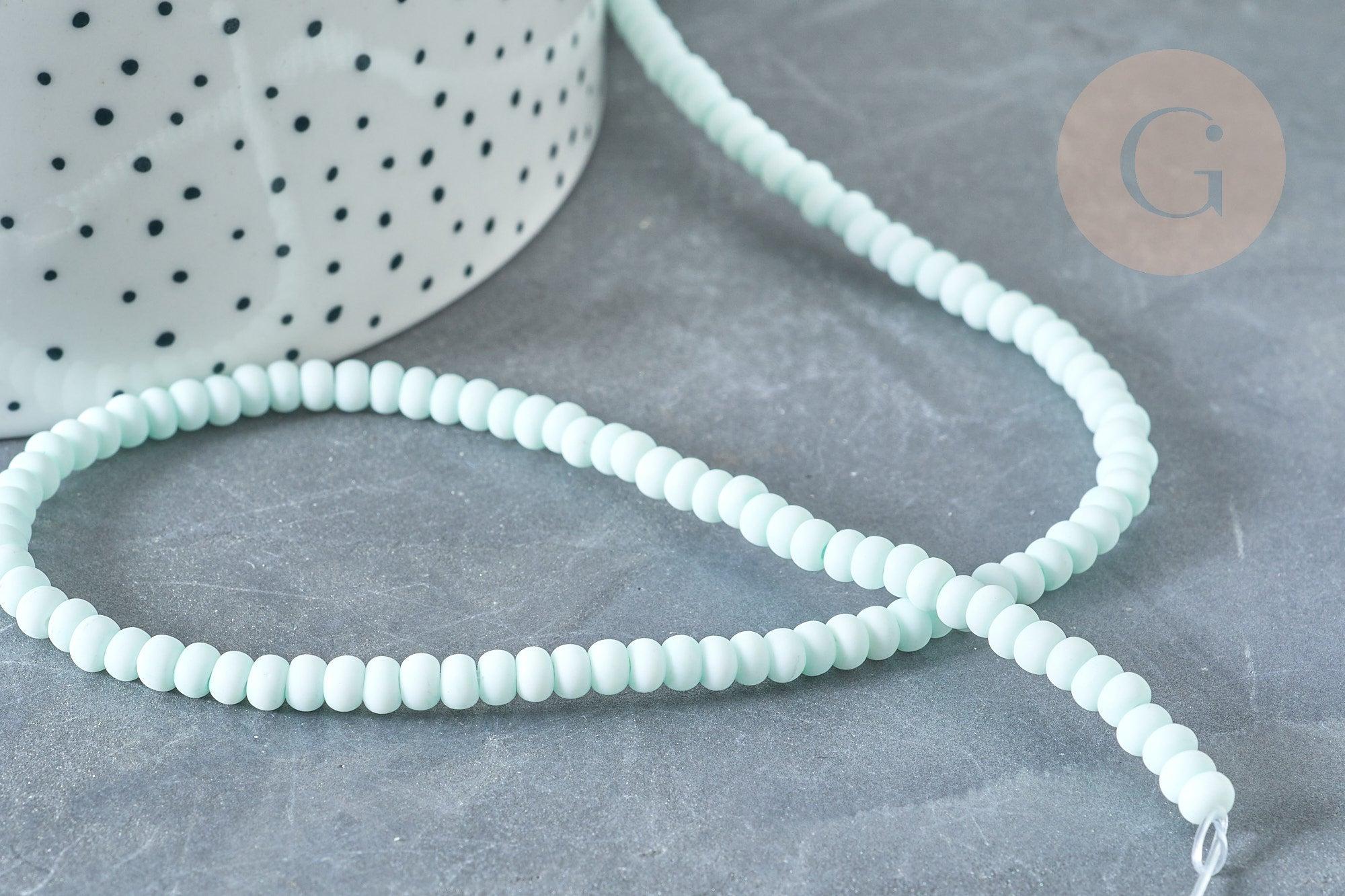Perles porcelaine abacus vert pâle 4x3mm, fil de 38cm, x1 (G7810)