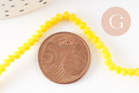 Perles toupies verre jaune facette 3mm, x1 fil de 38cm (G2669)