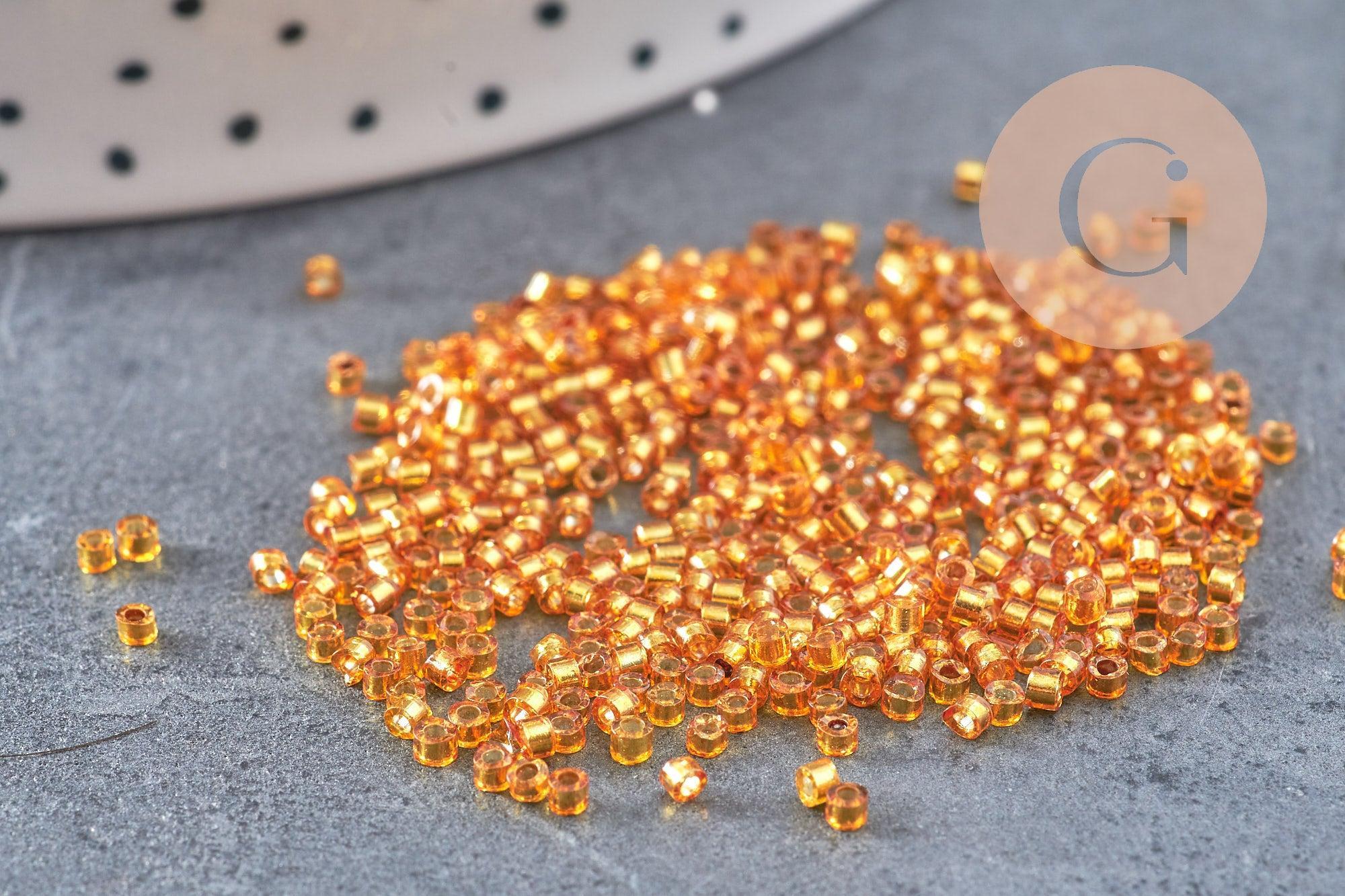 Perles tube verre orange transparent silver line façon Delica miyuki, x1 sachet de 8g (G10923)